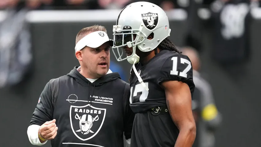 LAS VEGAS, NEVADA – DECEMBER 04: Head coach Josh McDaniels speaks to wide receiver Davante Adams #17 of the Las Vegas Raiders before a game against the Los Angeles Chargers at Allegiant Stadium on December 04, 2022 in Las Vegas, Nevada. (Photo by Chris Unger/Getty Images)