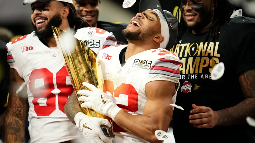 Ohio State Buckeyes running back TreVeyon Henderson (32) celebrates with the trophy following the 34-23 win over the Notre Dame Fighting Irish to win the College Football Playoff National Championship at Mercedes-Benz Stadium in Atlanta on Jan. 22, 2025.
